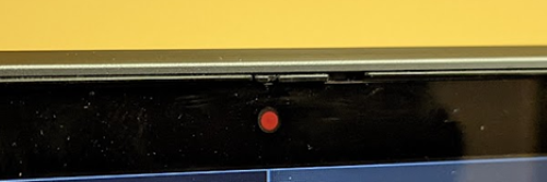 The red dot over the camera signifying the camera shutter is closed