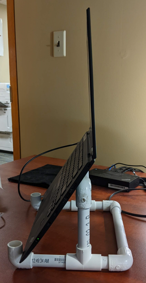 A laptop positioned onto the stand