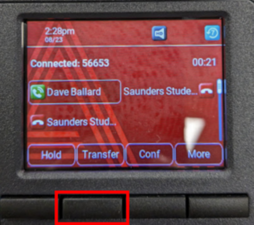 The main screen of an Avaya phone system with the button to transfer a call highlighted in red